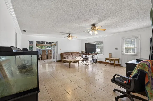 a view of a livingroom with furniture and a window