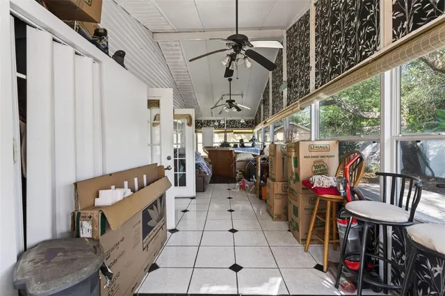 a view of an chairs and table in a livingroom with furniture