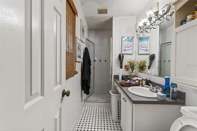 a bathroom with a sink double vanity and shower