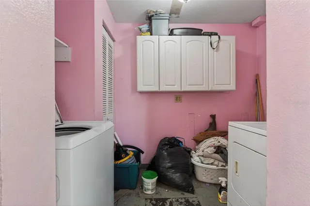 a bathroom with a sink a stove and curtain