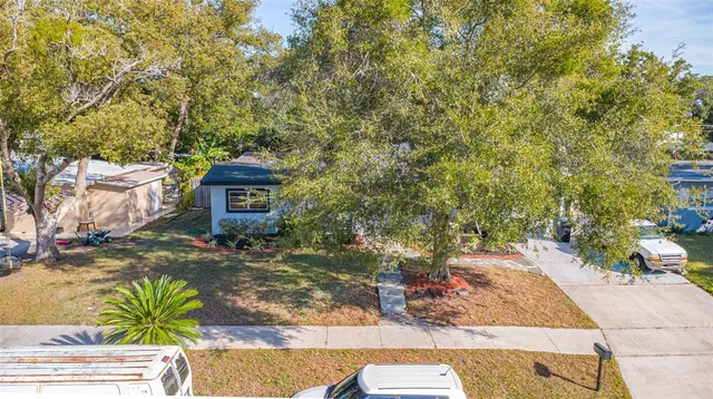 an aerial view of residential houses with outdoor space