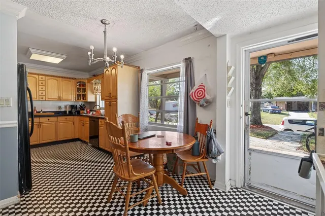 a view of kitchen and dining area with furniture