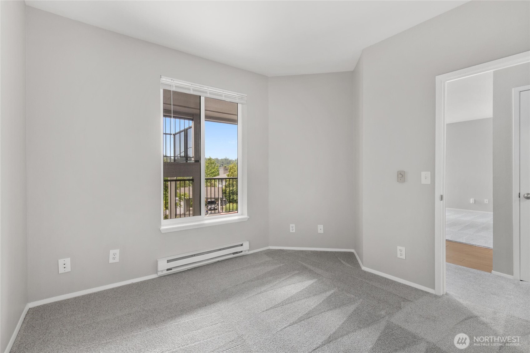 3926 243rd Place Southeast, Unit H201 Bothell, WA 98021 - Photo 14 of 31 an empty room with a window