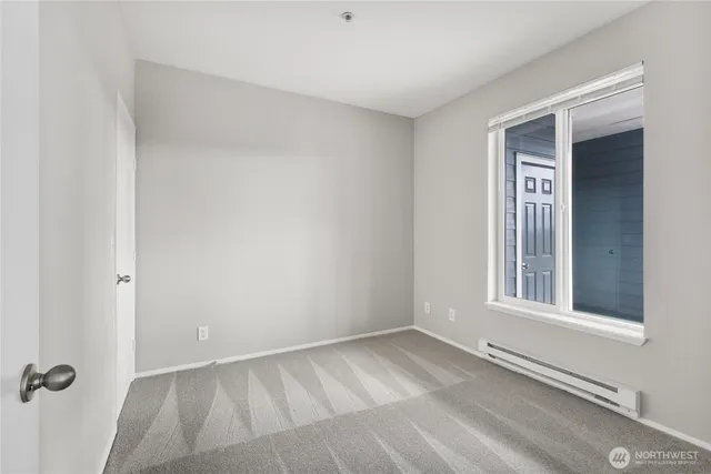 a bathroom with a double vanity sink mirror and toilet