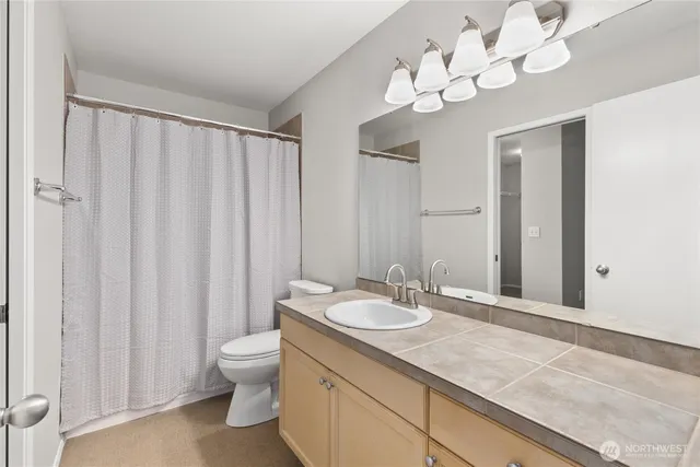 a view of an empty room with a cabinet