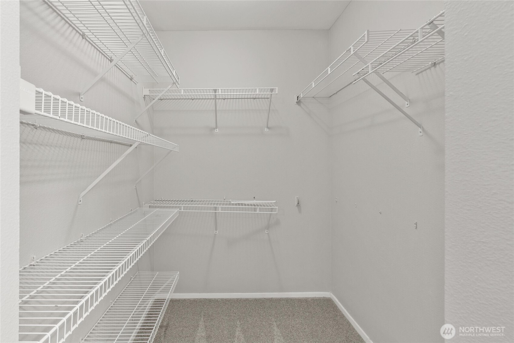 3926 243rd Place Southeast, Unit H201 Bothell, WA 98021 - Photo 19 of 31 a view of a room with racks on the wall