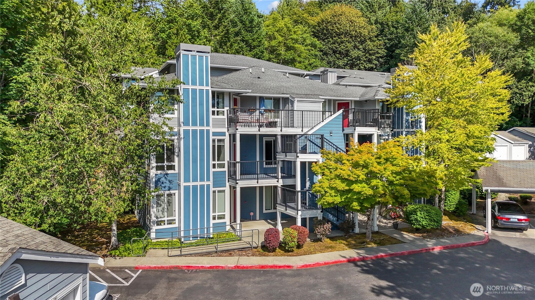 3926 243rd Place Southeast, Unit H201 Bothell, WA 98021 - Photo 29 of 31 a front view of a house with street