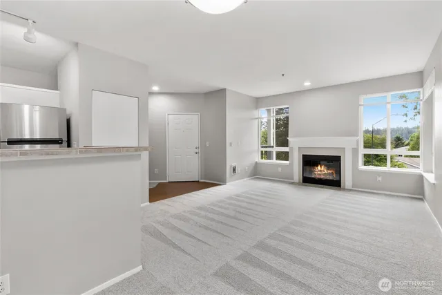 a view of an empty room with a window