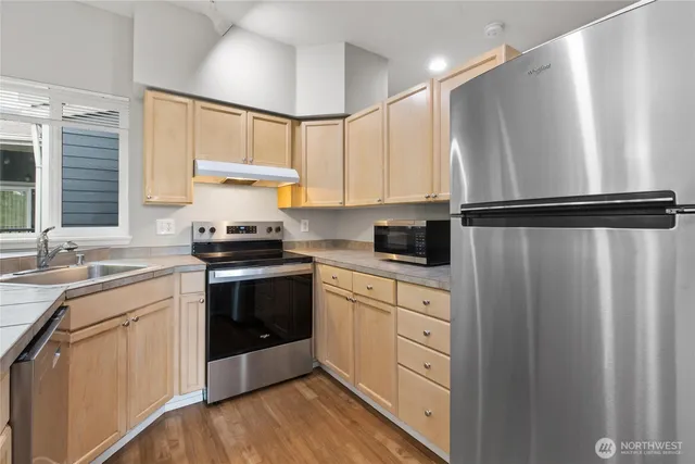 a kitchen with a sink and a fireplace