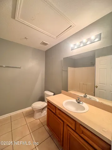 a bathroom with a sink toilet and vanity
