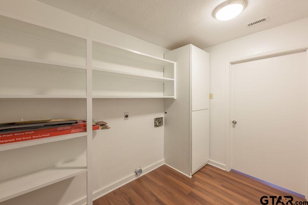 14212 Arber Street Flint, TX 75762 - Photo 17 of 38 a view of storage and utility room with empty racks