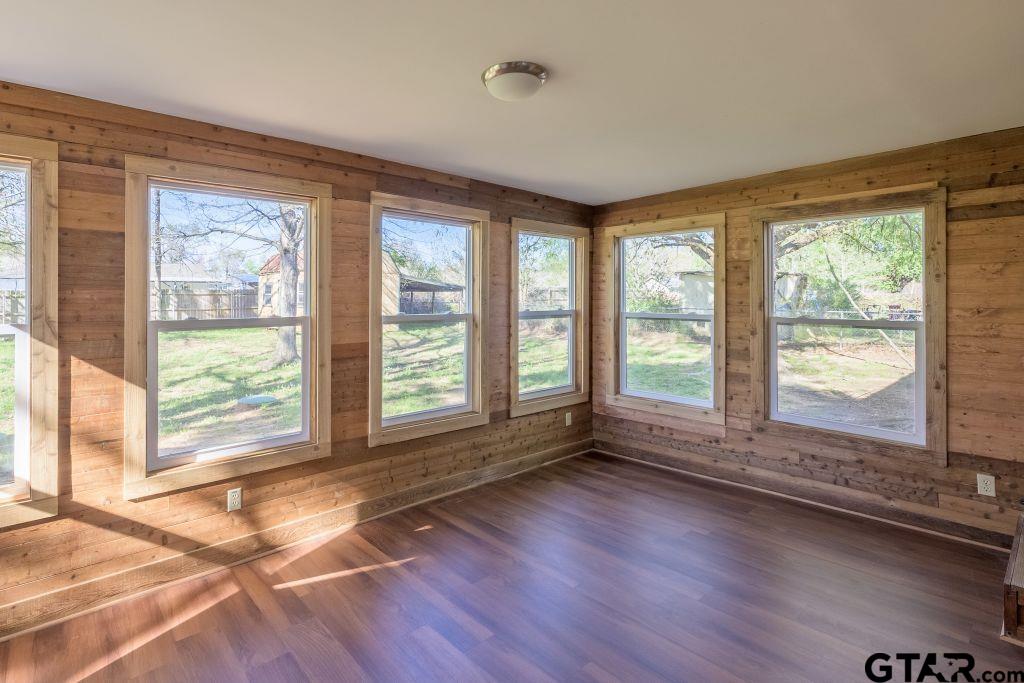 14212 Arber Street Flint, TX 75762 - Photo 18 of 38 a view of an empty room with wooden floor and a window