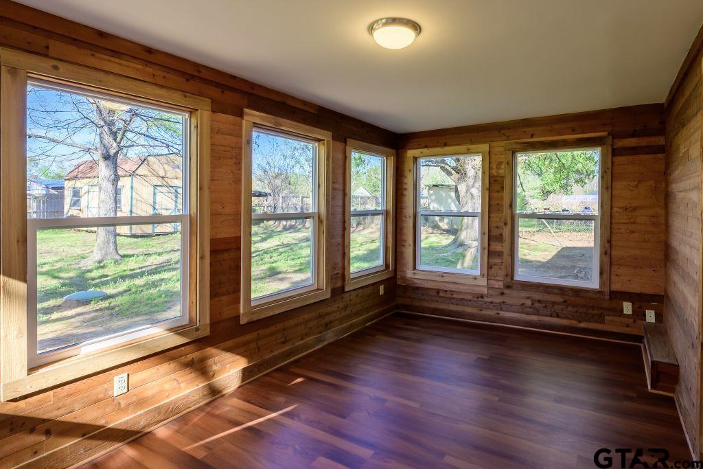 14212 Arber Street Flint, TX 75762 - Photo 2 of 38 a view of room with window and wooden floor