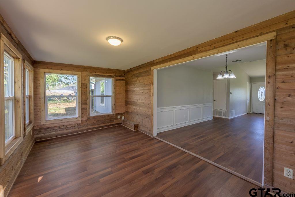 14212 Arber Street Flint, TX 75762 - Photo 21 of 38 an empty room with wooden floor and windows