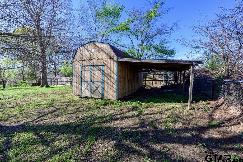 14212 Arber Street Flint, TX 75762 - Photo 34 of 38 a wooden fence with some trees in the background