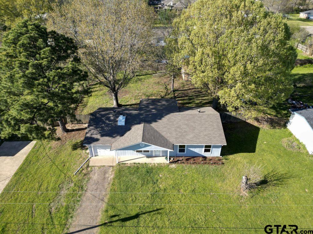 14212 Arber Street Flint, TX 75762 - Photo 36 of 38 a view of swimming pool with a patio and a yard