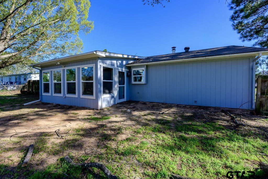 14212 Arber Street Flint, TX 75762 - Photo 6 of 38 a view of a house with a backyard
