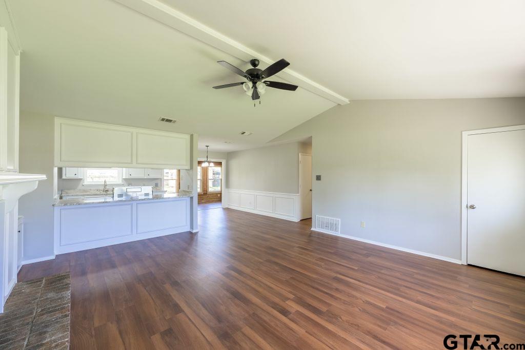14212 Arber Street Flint, TX 75762 - Photo 8 of 38 a view of a kitchen with a sink and dishwasher a refrigerator with wooden floor