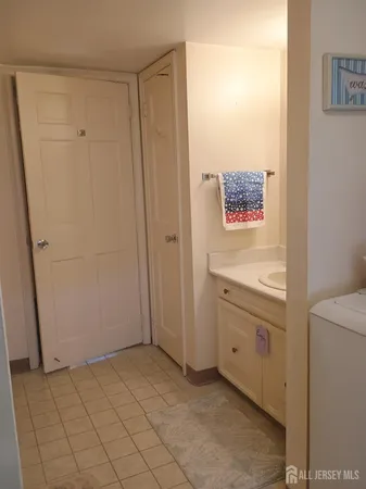 a room with furniture a rug and a closet