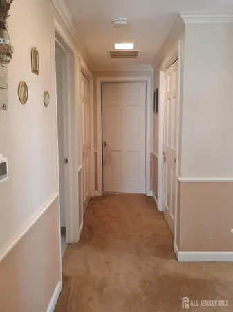 a view of a hallway with closet area
