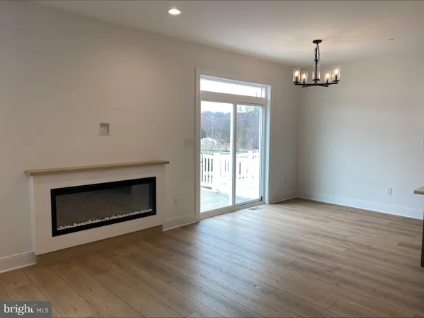 wooden floor fireplace and windows in a room