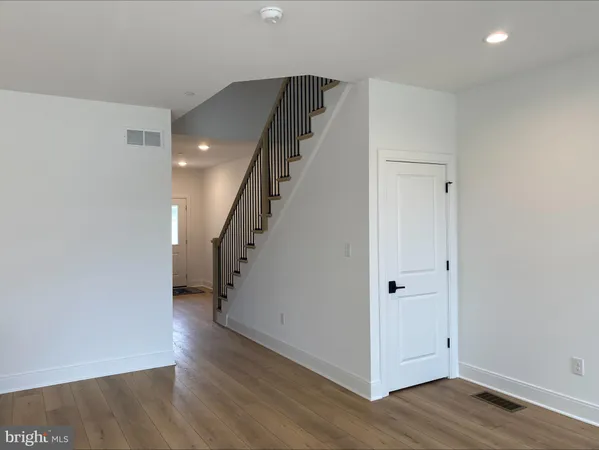 a view of entryway with wooden floor