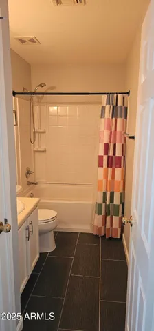 a bathroom with a toilet a sink and a shower