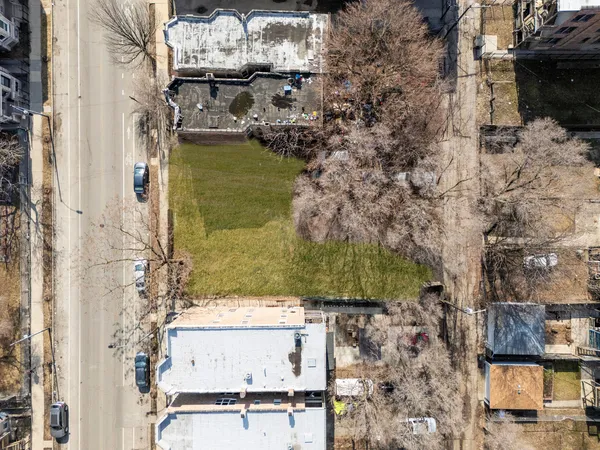 a aerial view of residential houses with outdoor space