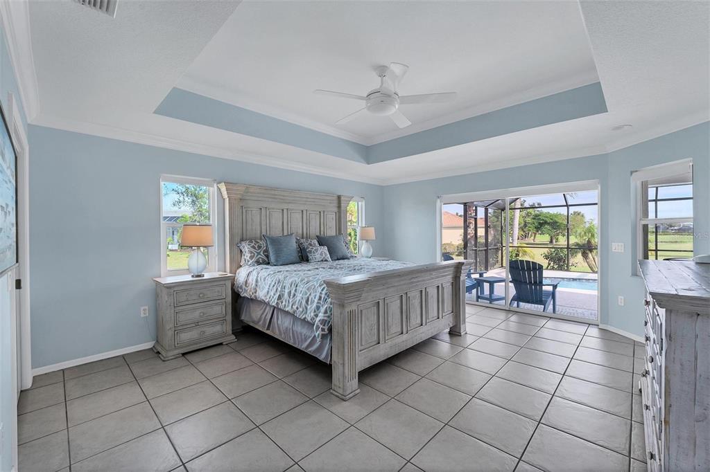 11 Amberjack Terrace Placida, FL 33946 - Photo 15 of 38 a bedroom with a bed and a table in it with window
