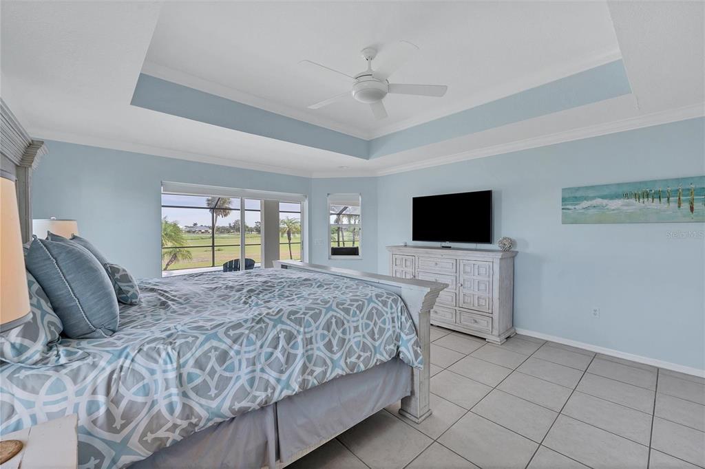 11 Amberjack Terrace Placida, FL 33946 - Photo 16 of 38 a bedroom with a bed and a flat screen tv