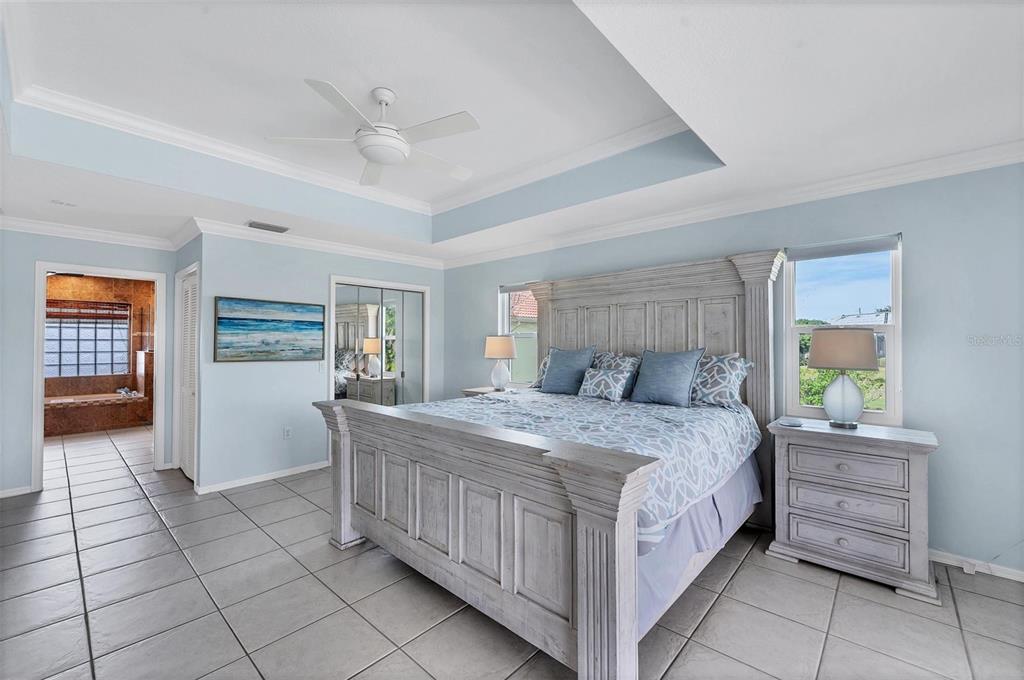 11 Amberjack Terrace Placida, FL 33946 - Photo 17 of 38 a bedroom with a bed and a cabinets