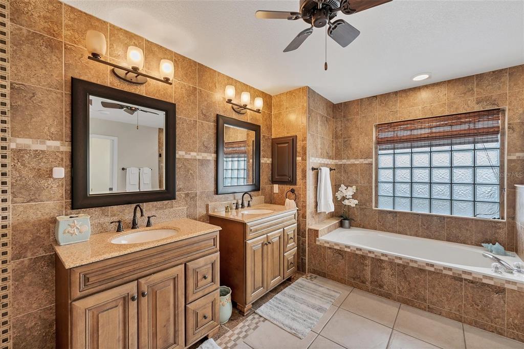 11 Amberjack Terrace Placida, FL 33946 - Photo 18 of 38 a bathroom with a tub sink and mirror