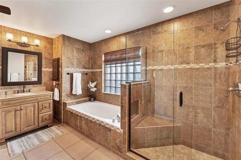 11 Amberjack Terrace Placida, FL 33946 - Photo 20 of 38 a bathroom with a tub a sink and mirror