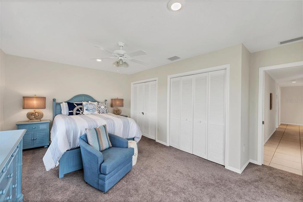 11 Amberjack Terrace Placida, FL 33946 - Photo 23 of 38 a bedroom with a bed and a lamp