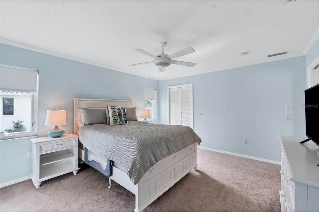 11 Amberjack Terrace Placida, FL 33946 - Photo 26 of 38 a bedroom with a bed and a flat screen tv