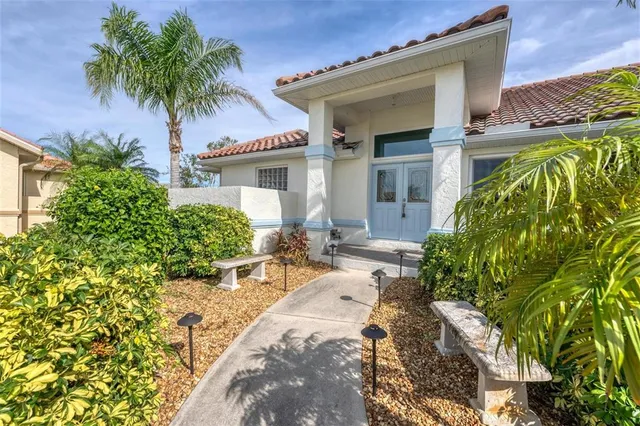 front view of a house with a garden