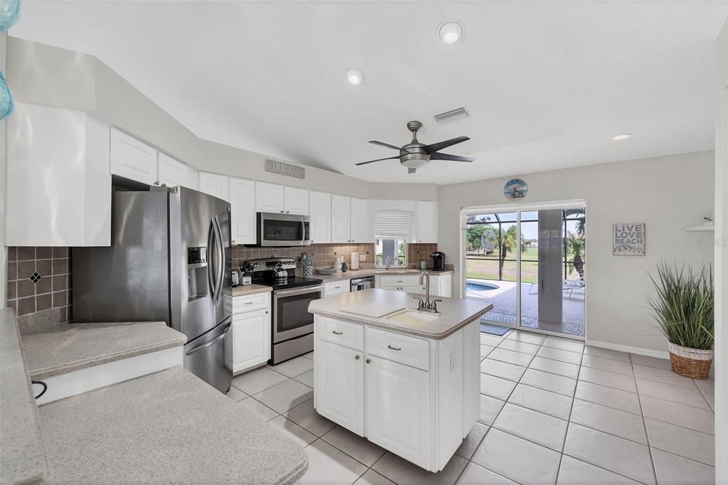 11 Amberjack Terrace Placida, FL 33946 - Photo 8 of 38 a kitchen with stainless steel appliances a refrigerator sink and microwave