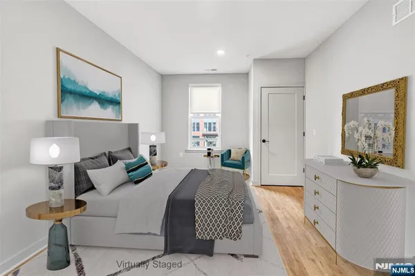 a bedroom with a bed and a couch