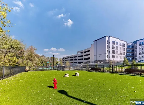 a view of yard with swimming pool and outdoor seating