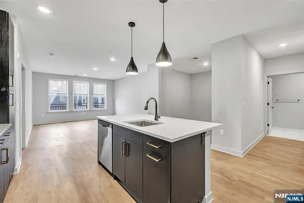 a kitchen with a sink and window
