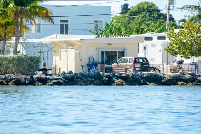 a bedroom with bed and a window