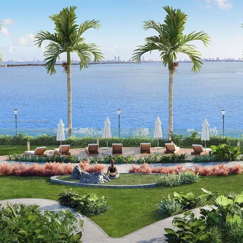 a view of a house with a garden and a yard