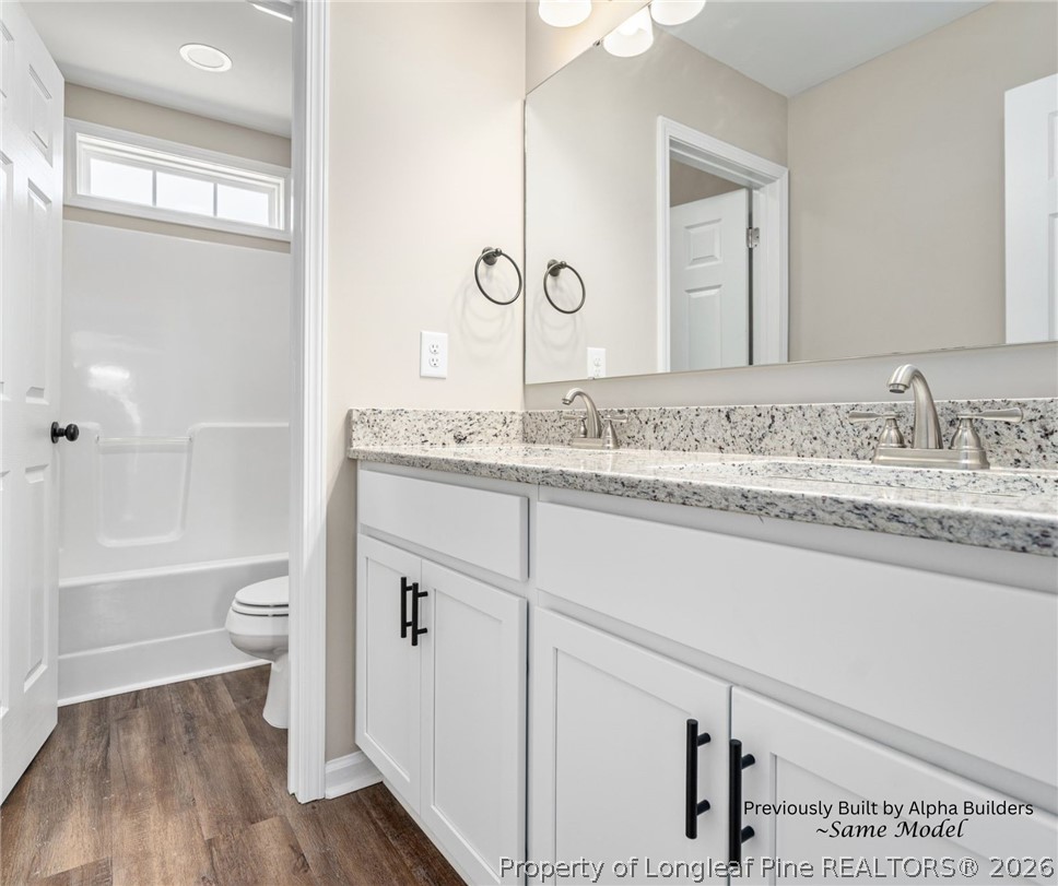 973 Martin Road St. Pauls, NC 28384 - Photo 17 of 19 Full guest bathroom featuring modern finishes and tub/shower combination.