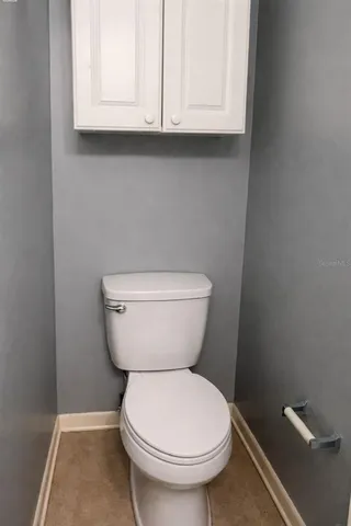 a bathroom with a toilet and a sink
