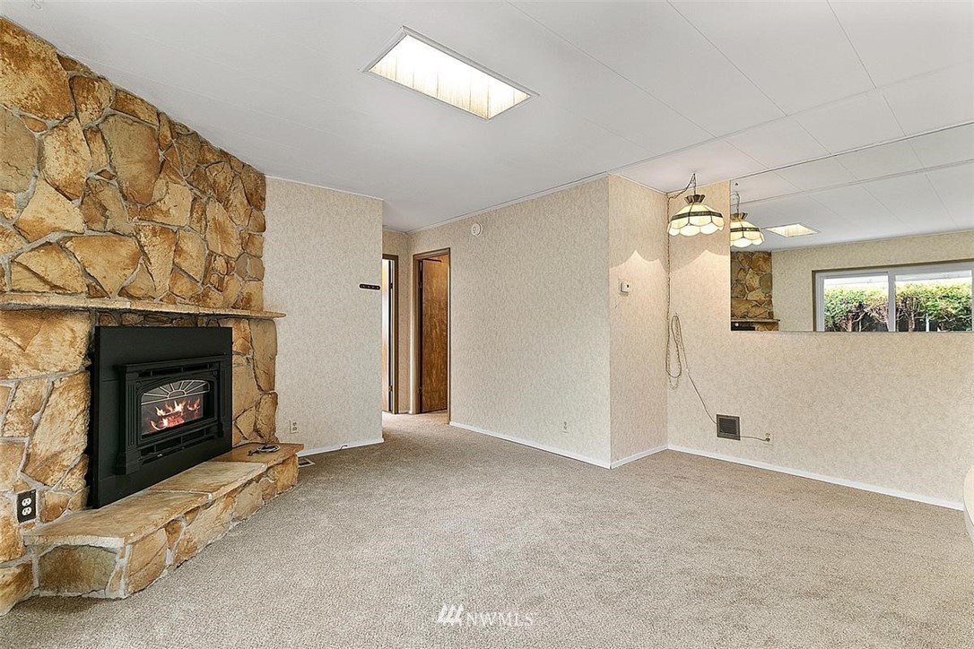 201 Union Avenue Southeast, Unit 135 Renton, WA 98059 - Photo 14 of 33 a view of a room with window and chandelier fan