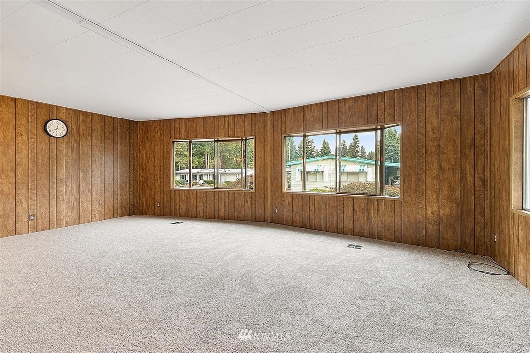 201 Union Avenue Southeast, Unit 135 Renton, WA 98059 - Photo 3 of 33 an empty room with windows