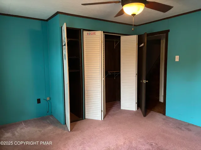an empty room with closet area