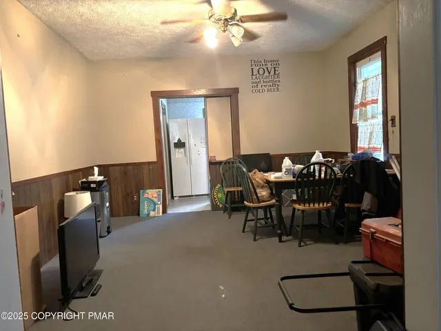 a dining room with furniture and window