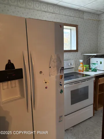 a kitchen with stainless steel appliances a refrigerator stove and sink