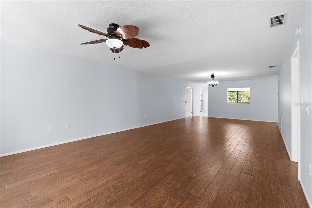 6110 Country Club Way, Unit 204 Sarasota, FL 34243 - Photo 12 of 66 a view of empty room with wooden floor